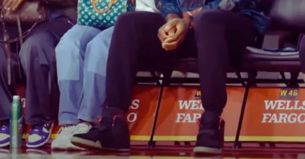 LeBron James donning Solar Red Yeezys at USC Game for Son